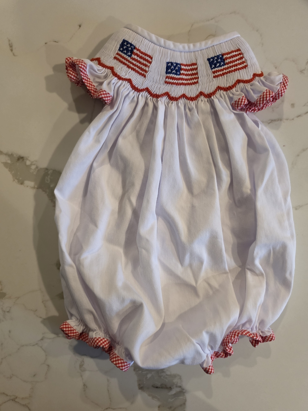 Cecil & Lou Girls' White Smocked American Flag Bubble Romper with Red Trim